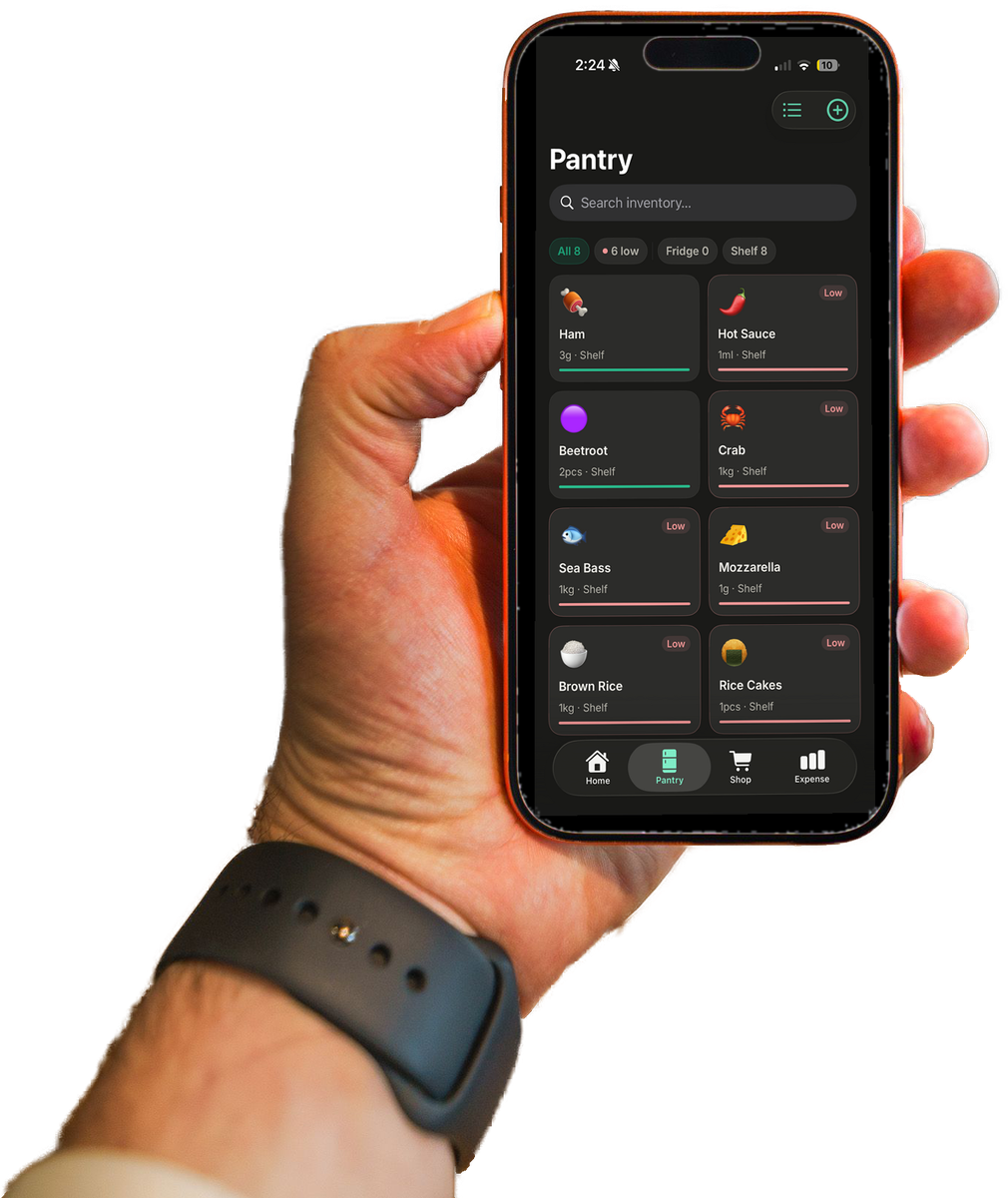A hand holding a phone showing the GrubShelf pantry screen